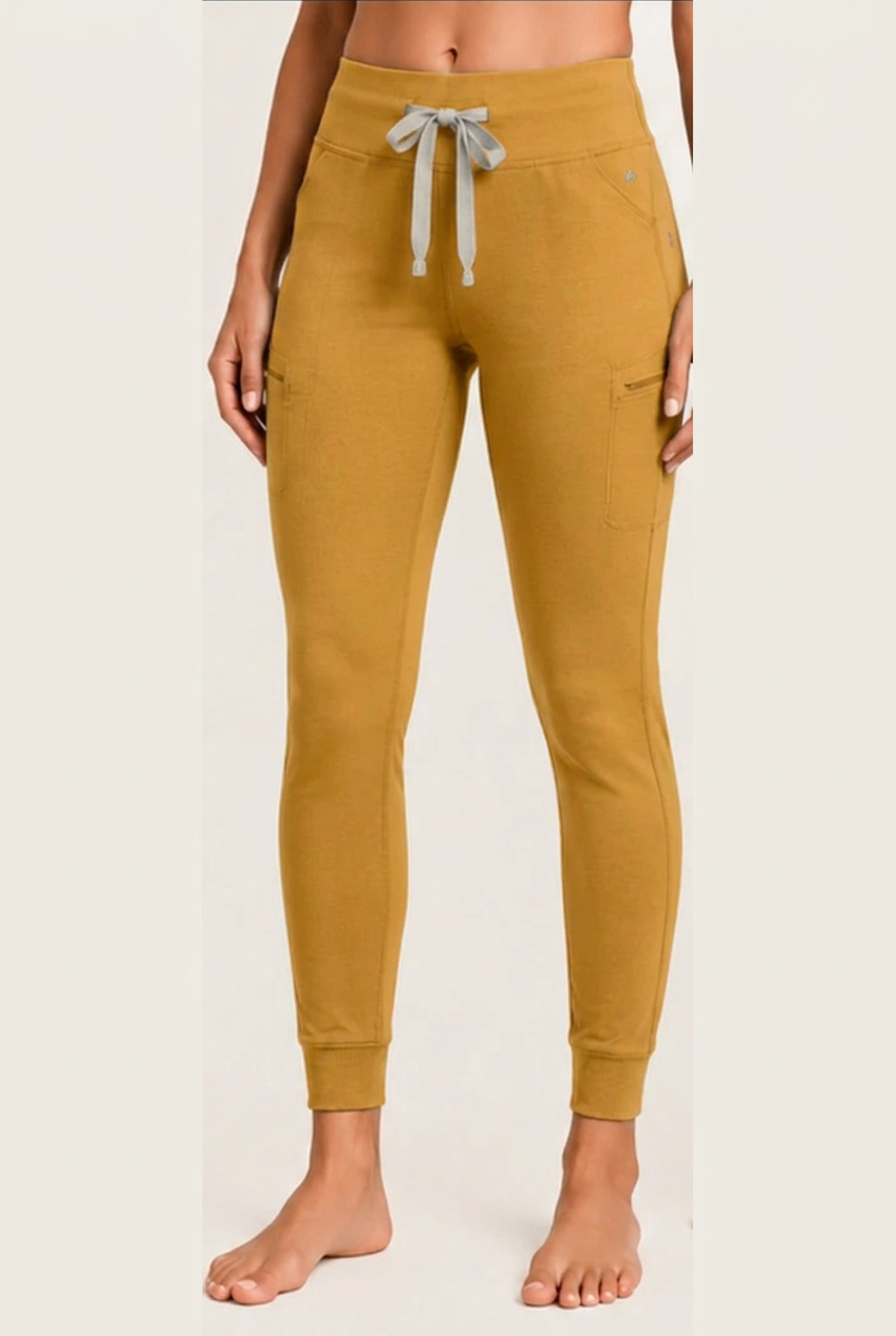 The Clover Legging in Mustard Yellow, shown from waistband to cuffed ankle