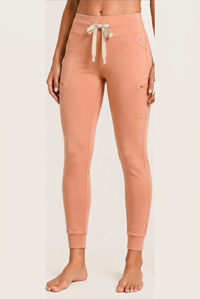 The Clover Legging in Peach, shown from waistband to cuffed ankle